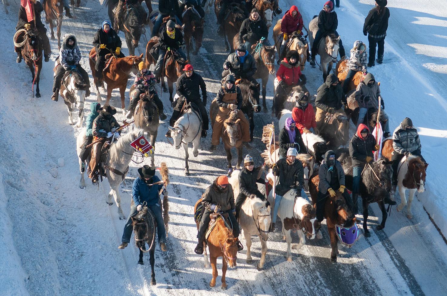 Dakota 38+2 Wokiksuye riders finish the last stretch of their 330-mile ride along Riverfront Avenue in Mankato on their way to Reconciliation Park in 2022.